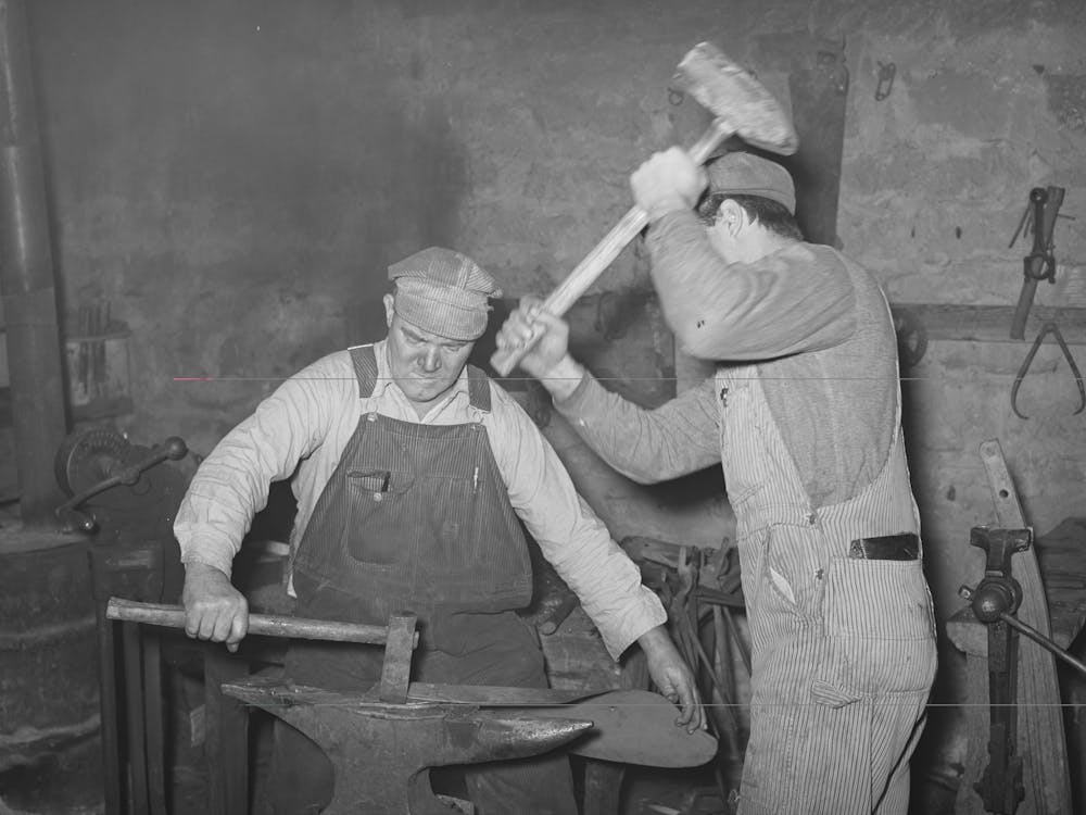 Blacksmith And Helper Pounding Out Plow Point,Depew, Oklahoma By Russell Lee