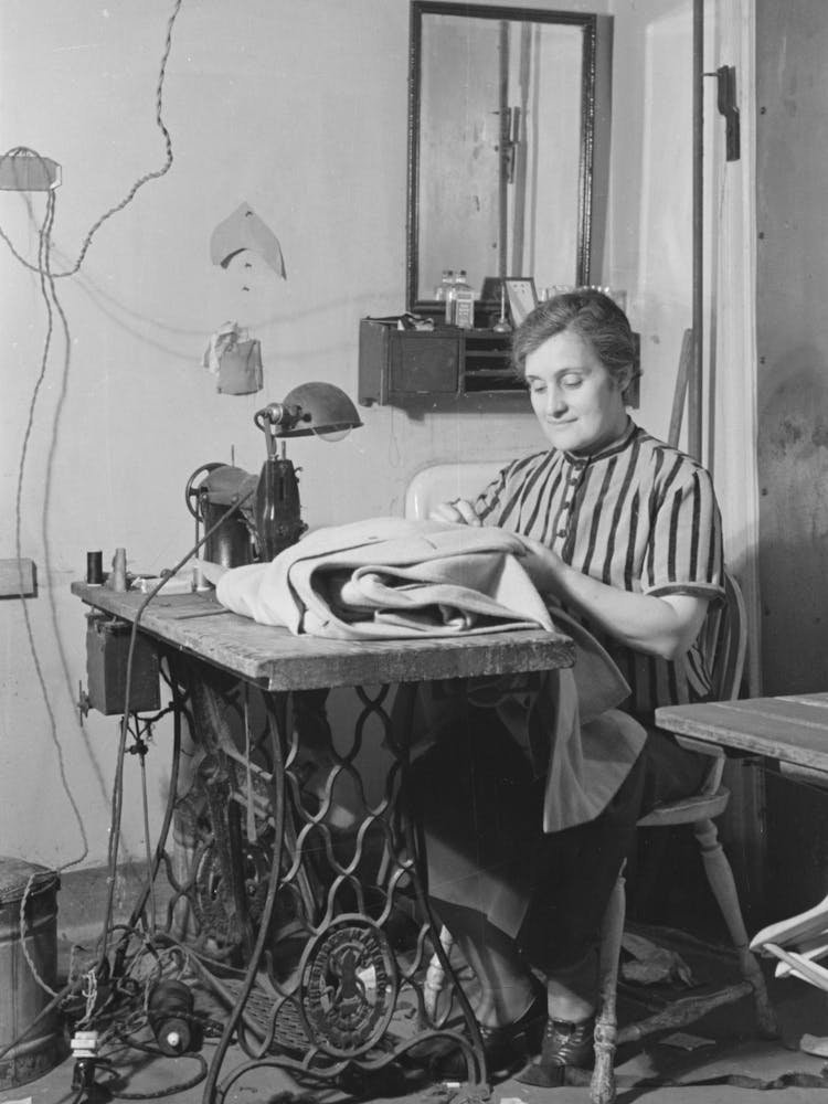 Woman At Sewing Machine In New York Tailor Shop On University Place Near 11th Street By Russell Lee