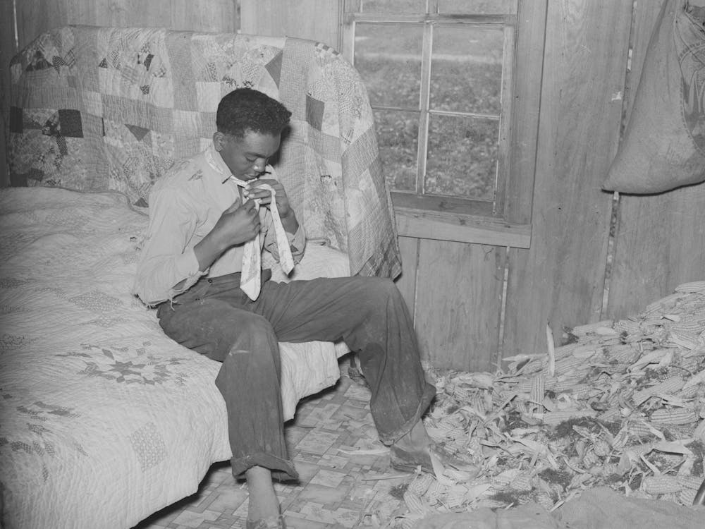 Southeast Missouri Farms, Son Of Sharecropper Dressing In Combination Bedroom And Corn Crib By Russell Lee