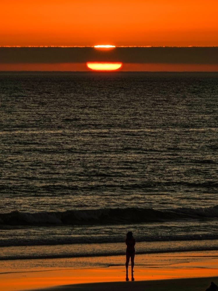 Sunset Gazing At The Beach