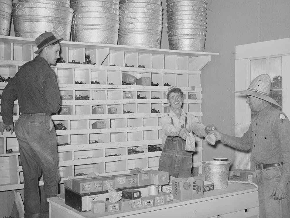 Mr Craig Handing Sackful Of Nails To A Farmer, Pie Town, New Mexico By Russell Lee