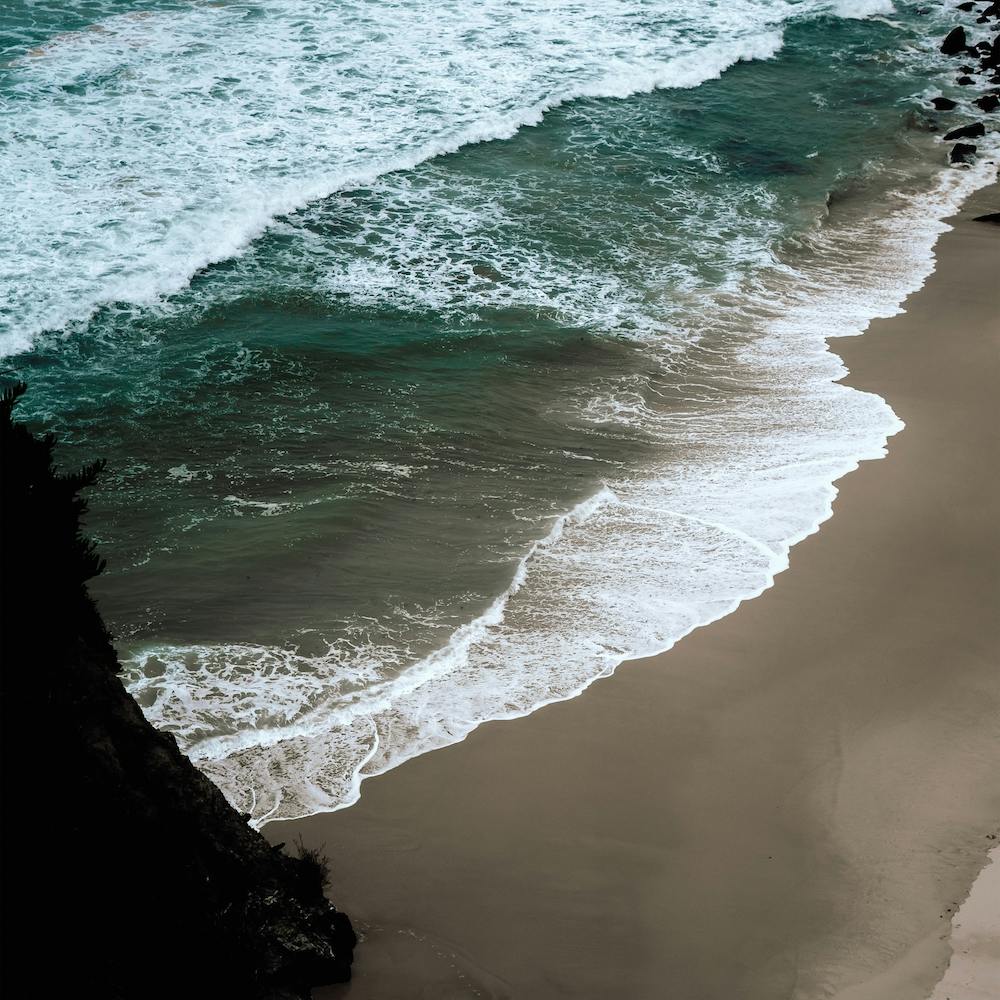Dark Beach, Bright Waves And Blue Sea  Aerial Ocean View  Colour Travel And Nature Photography  Portrait Square