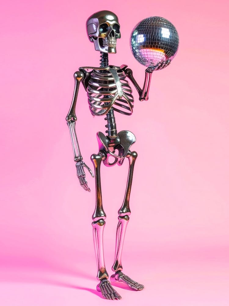 Skeleton Holding Mirror Disco Ball