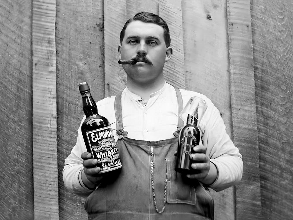 Prohibition, Man Holding A Bottle Of Whiskey, Black and White Old Photo