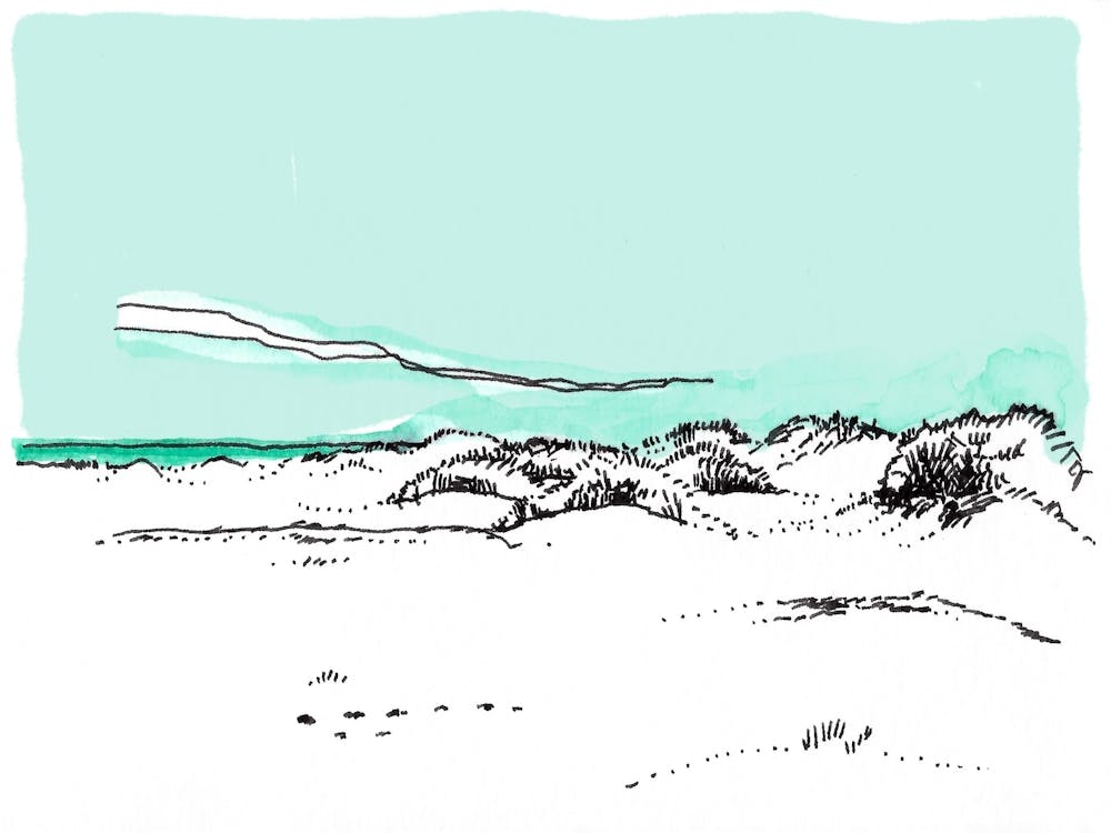 Sand Dunes Under A Blue Sky