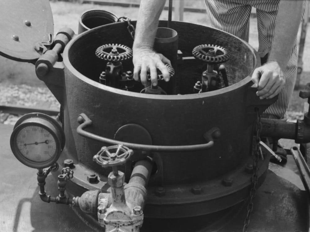 Untitled Photo, Possibly Related To Opening The Valves In A Tank Car Containing Gas, Seminole, Oklahoma