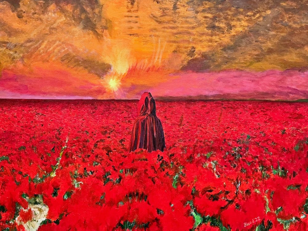 Mann in roter Robe in einem Meer aus Rot vor rotem Himmel
