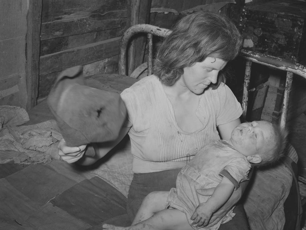 Mother Fanning Child With Old Hat To Keep Off Flies, Mays Avenue Camp, Oklahoma City, Oklahoma See Genera