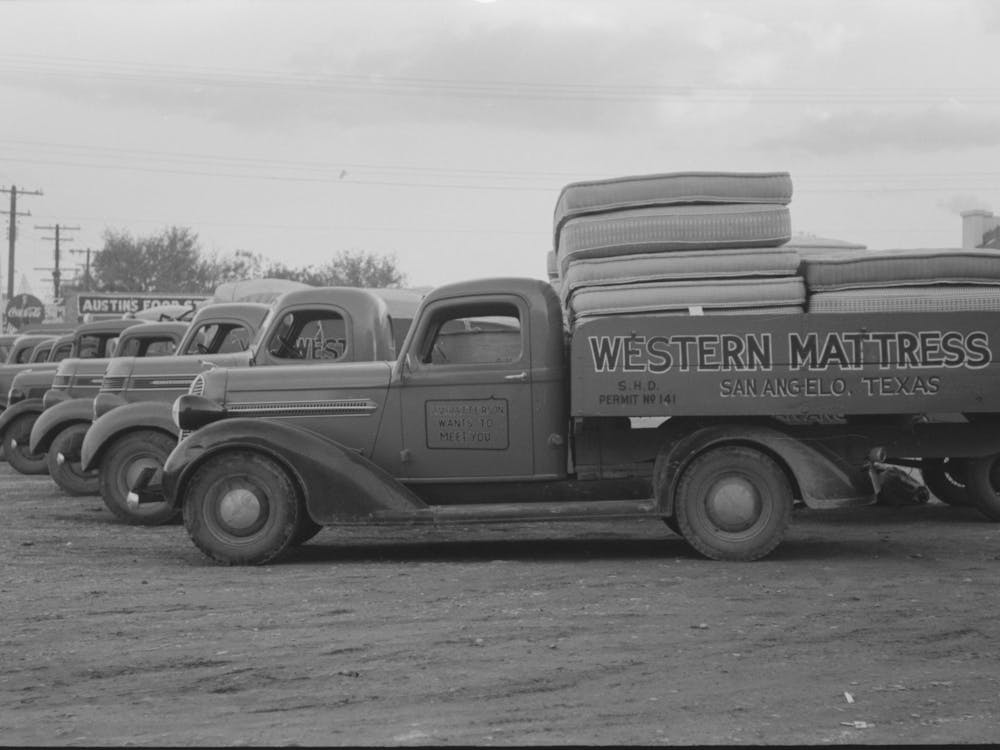 Trucks Loaded With Mattresses, San Angelo, Texas,These Mattress Factories Use Much Local Cotton By Russell Lee