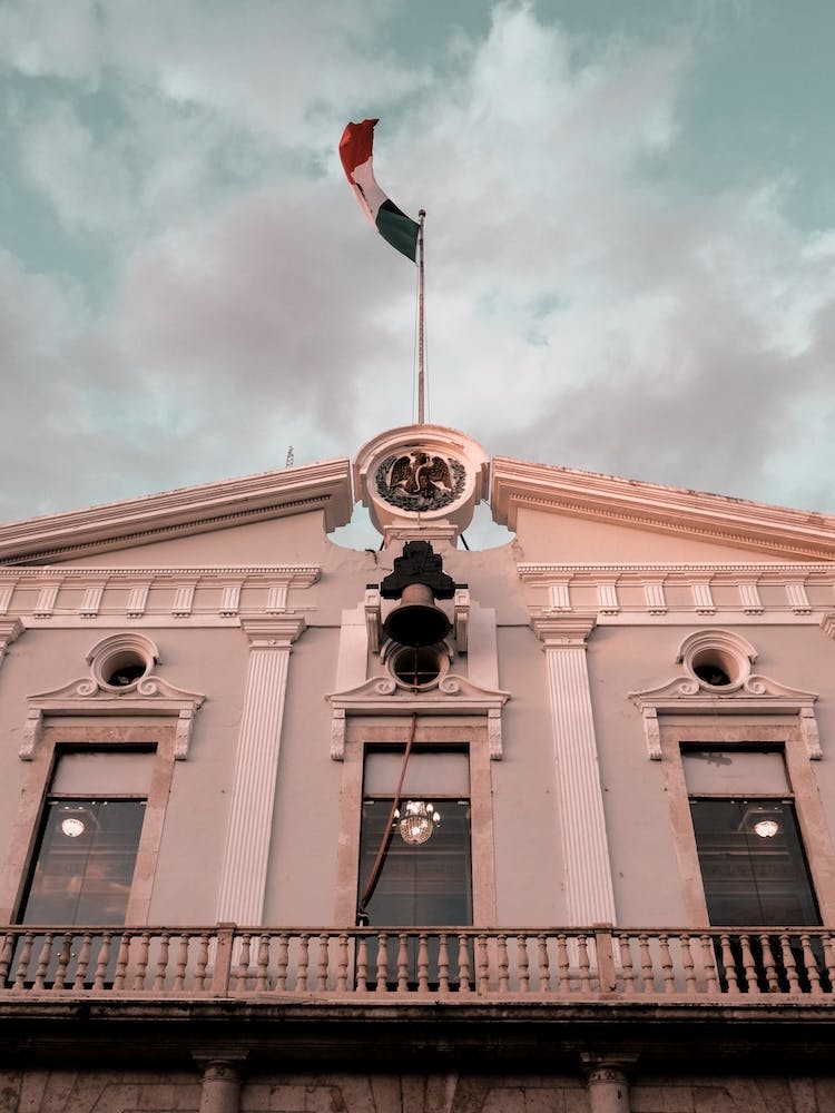 Mexican Farcade And Flag In Merida