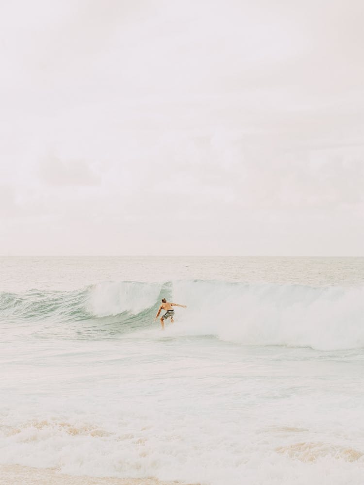 Surfer Catching A Wave