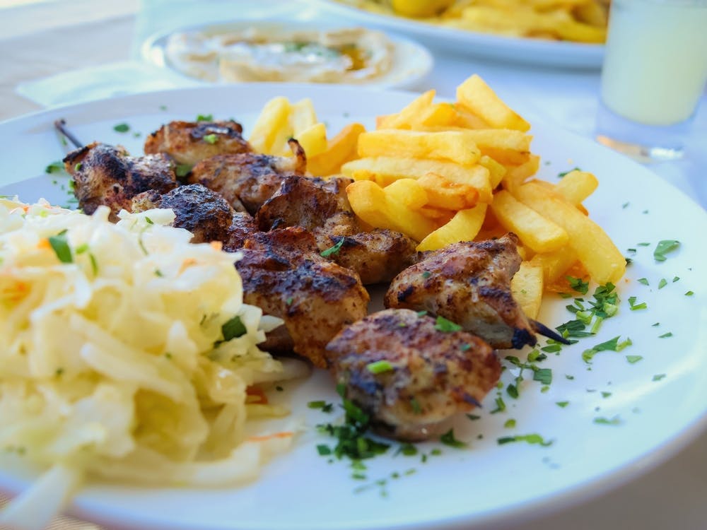 Grilled Shashlik With French Fries On Plate