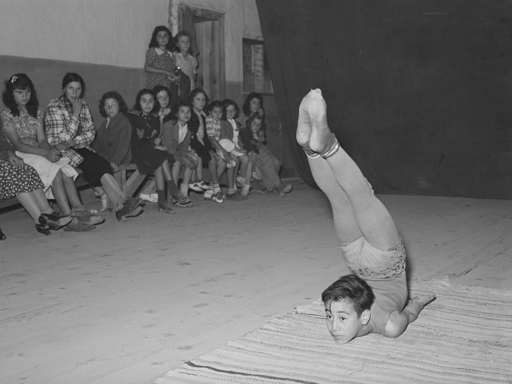 Spanish American Acrobat Of Traveling Show, Audience In Background, Penasco, New Mexico By Russell Lee