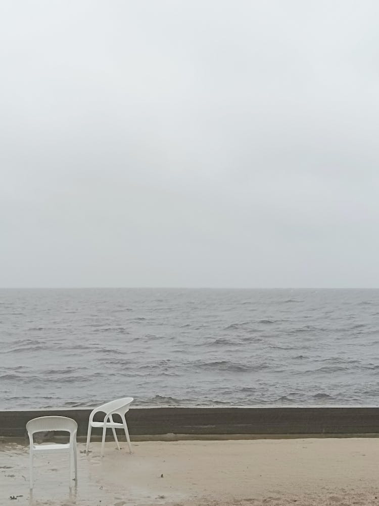 White Chairs art photo photography beige gray rainy day sea water lonelines serene contemporary