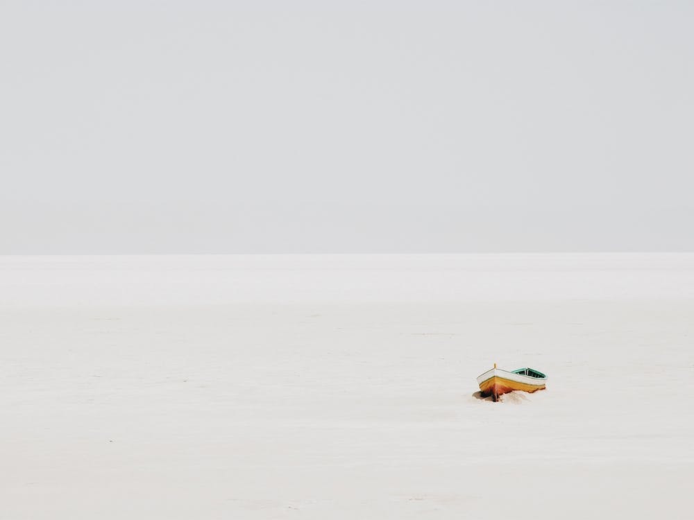 Boat On White Sand Beach