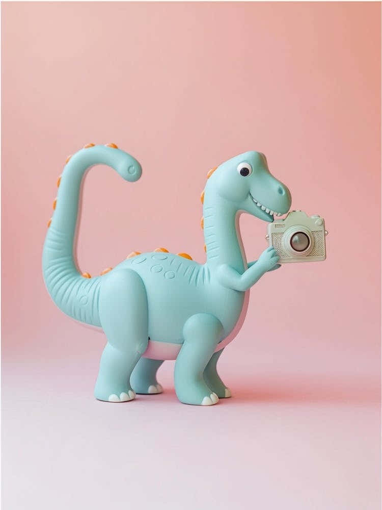 Pastel Toy Dinosaur Taking A Photo On An Analogue Camera 2