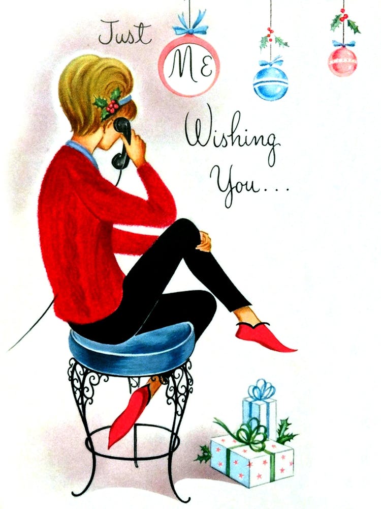 Young Woman In Christmas Mood Talking On A Phone