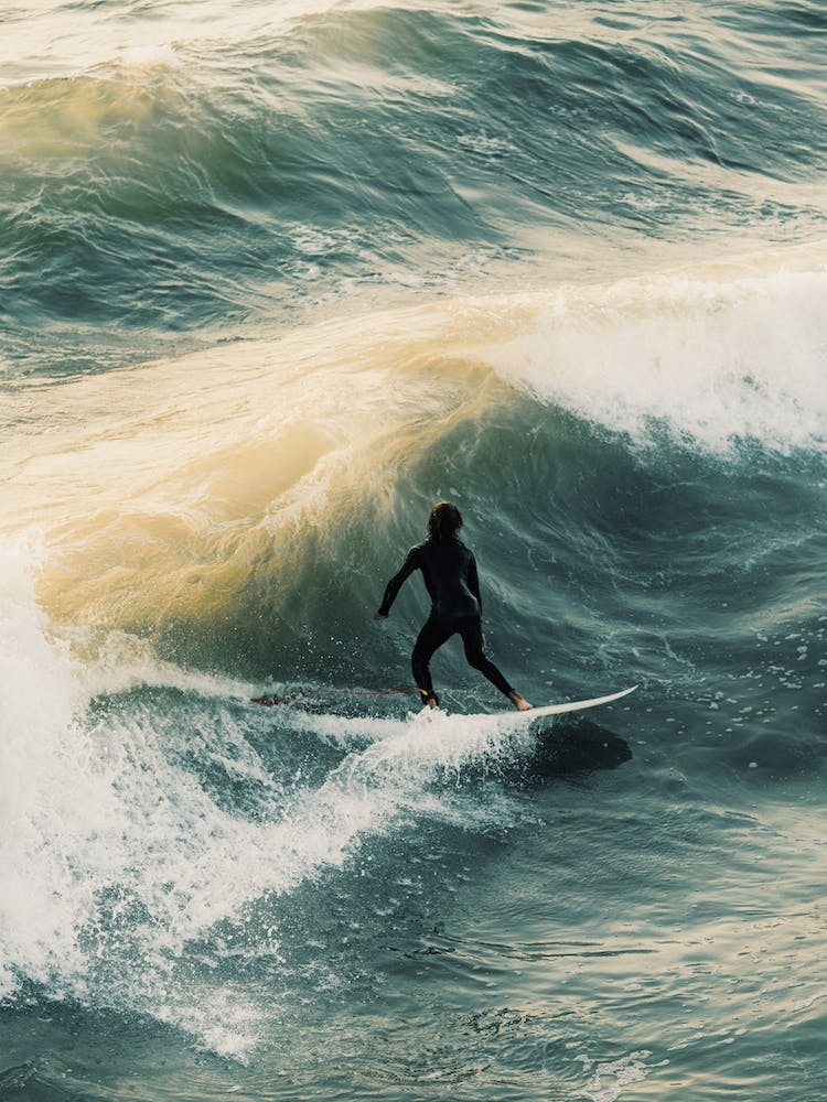 Surfer Ripping Waves