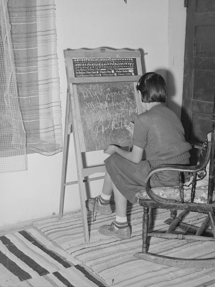 Spanish American Girl Who Is Learning English With The Aid Of Board Instruction, Chamisal, New Mexico By Russell Lee