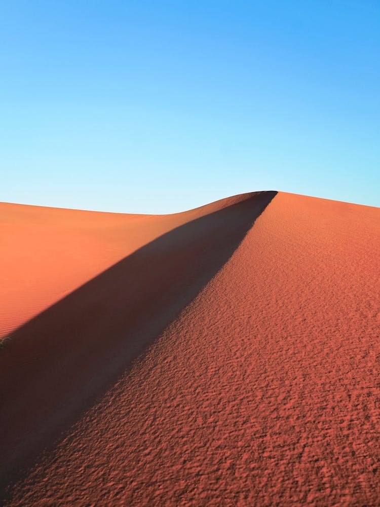 Sand Dunes in Sahara Desert against Blue Sky