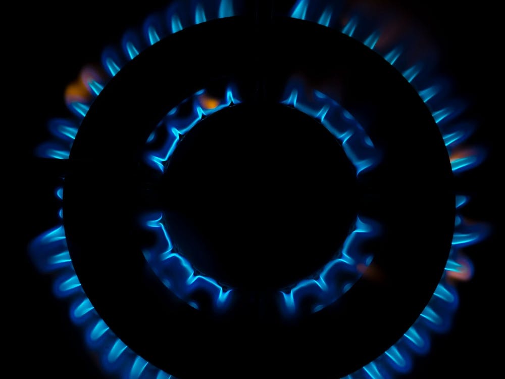 Gas Burner Flames Closeup Top View Isolated On Black Background