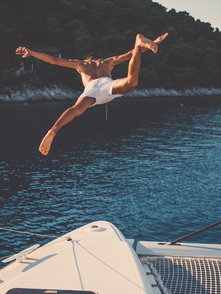Man Jumping Off A Yacht 1