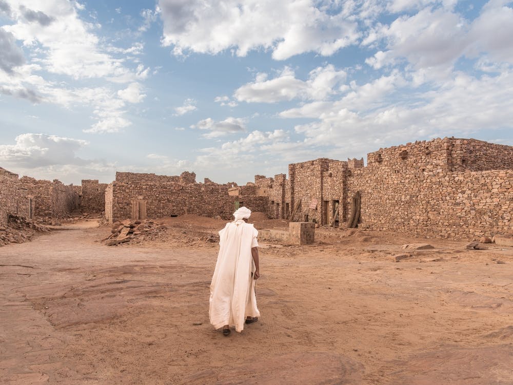 Walking Through An Ancient City In The Desert