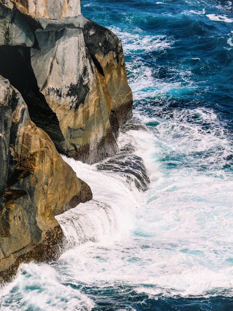 Ocean Surf And Rocky Shore