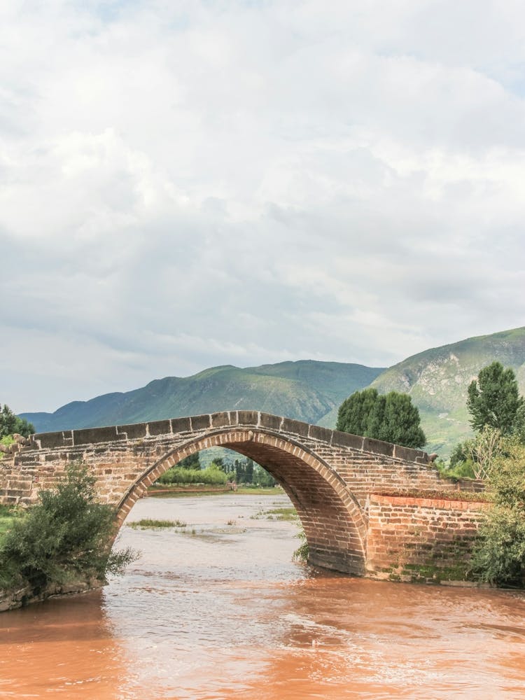 Bridge Over A River In Shaxi, China