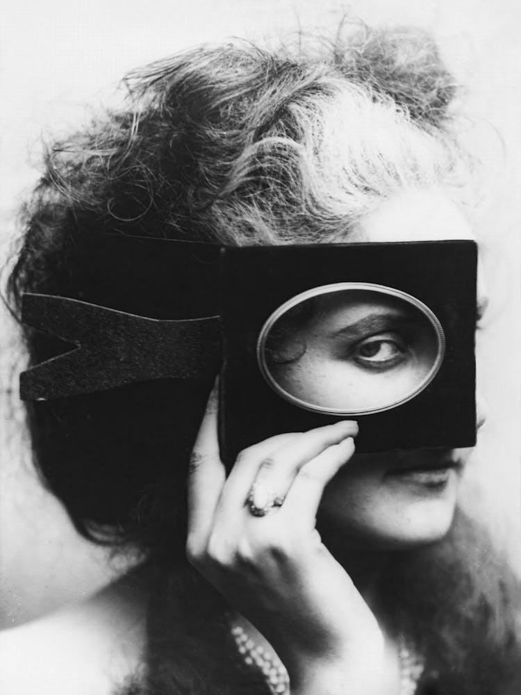 Woman With A Mask from a Picture Frame, Black and White Old Photo