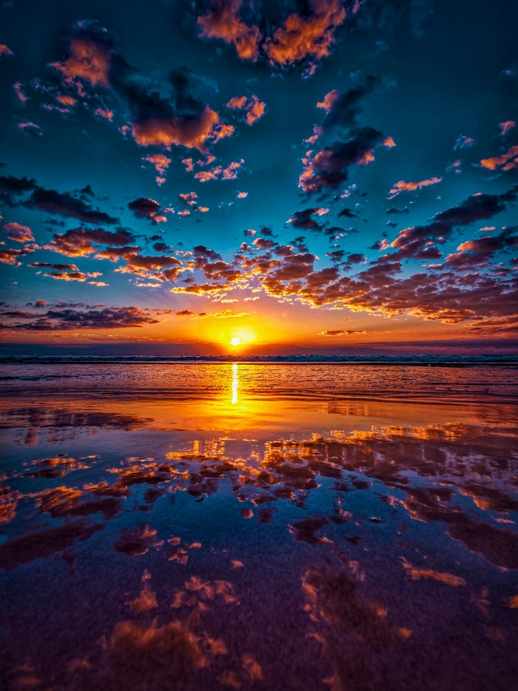 Sunrise Reflected In Water