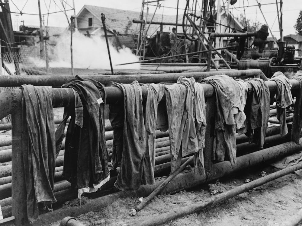 Clothing Of Oil Drilling Workers Drying On Steam Pipe, Kilgore, Texas By Russell Lee