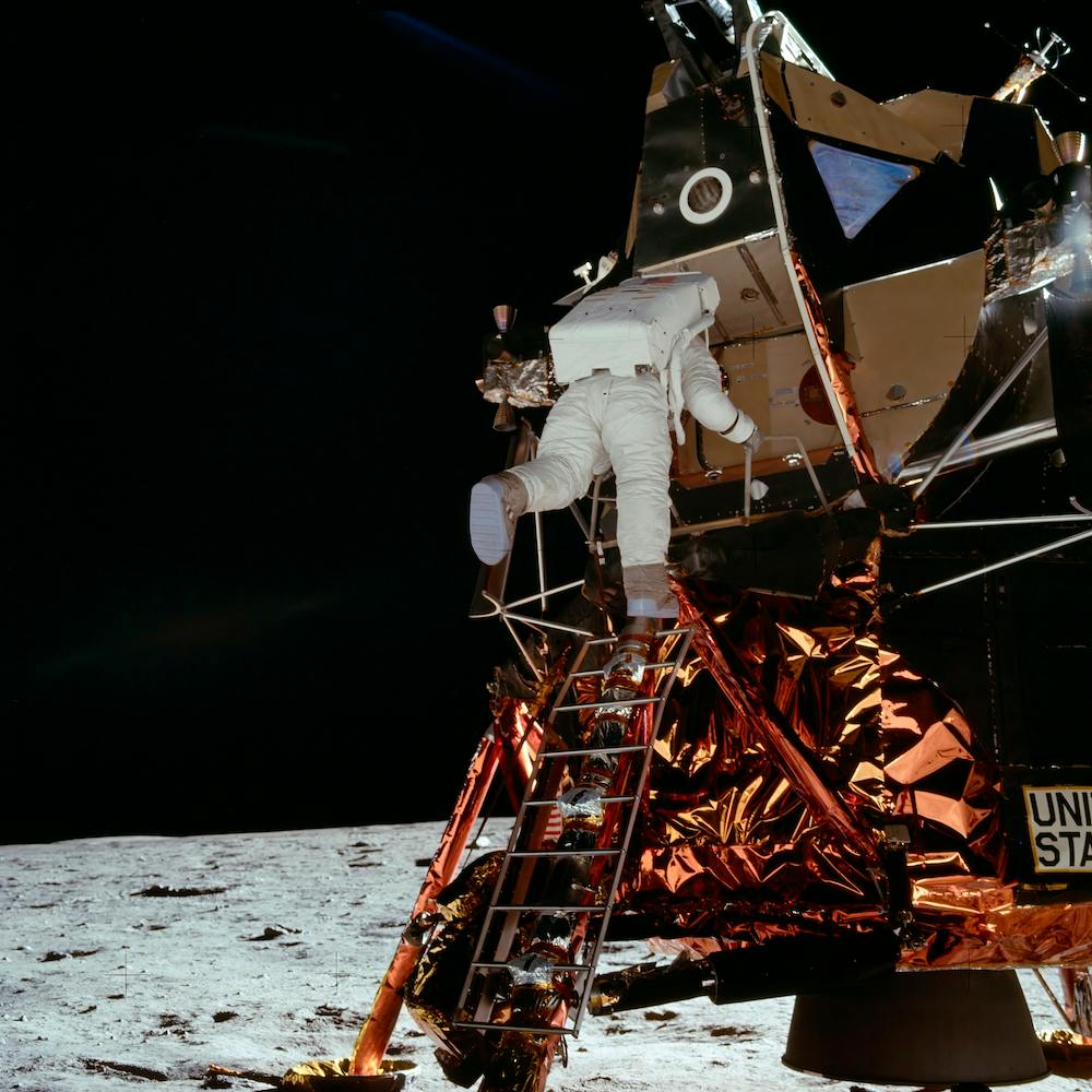 Astronaut Edwin E Aldrin Jr, Lunar Module (Lm), Pilot Descends From The Lm, Climbing Down The Ladder