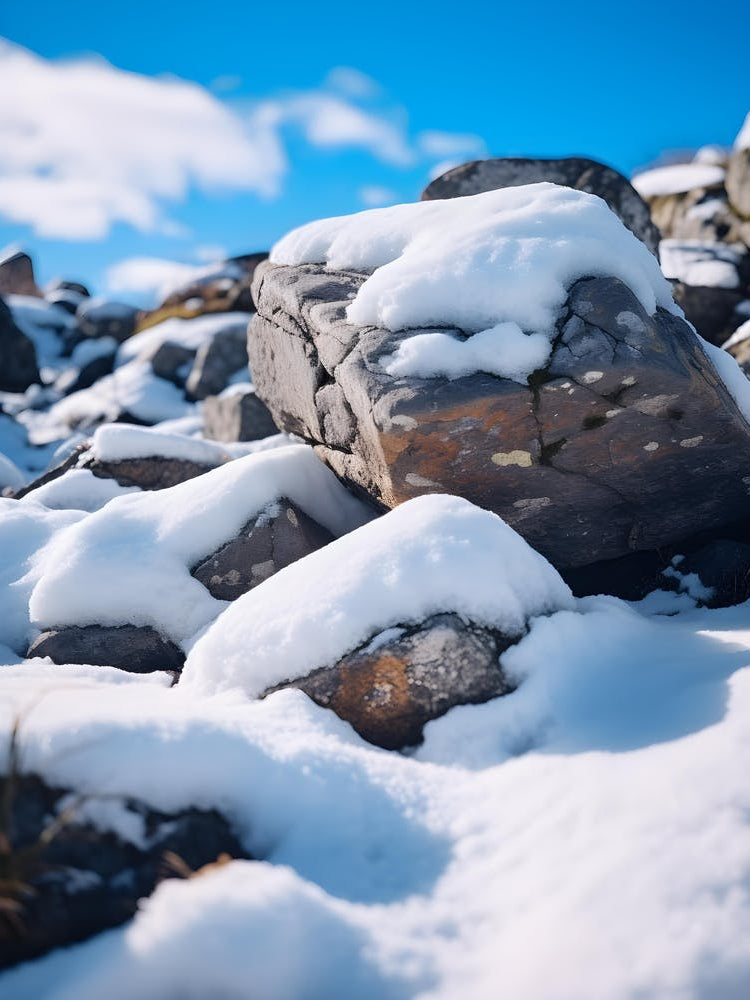 Snow Covered Stones in the Mountains