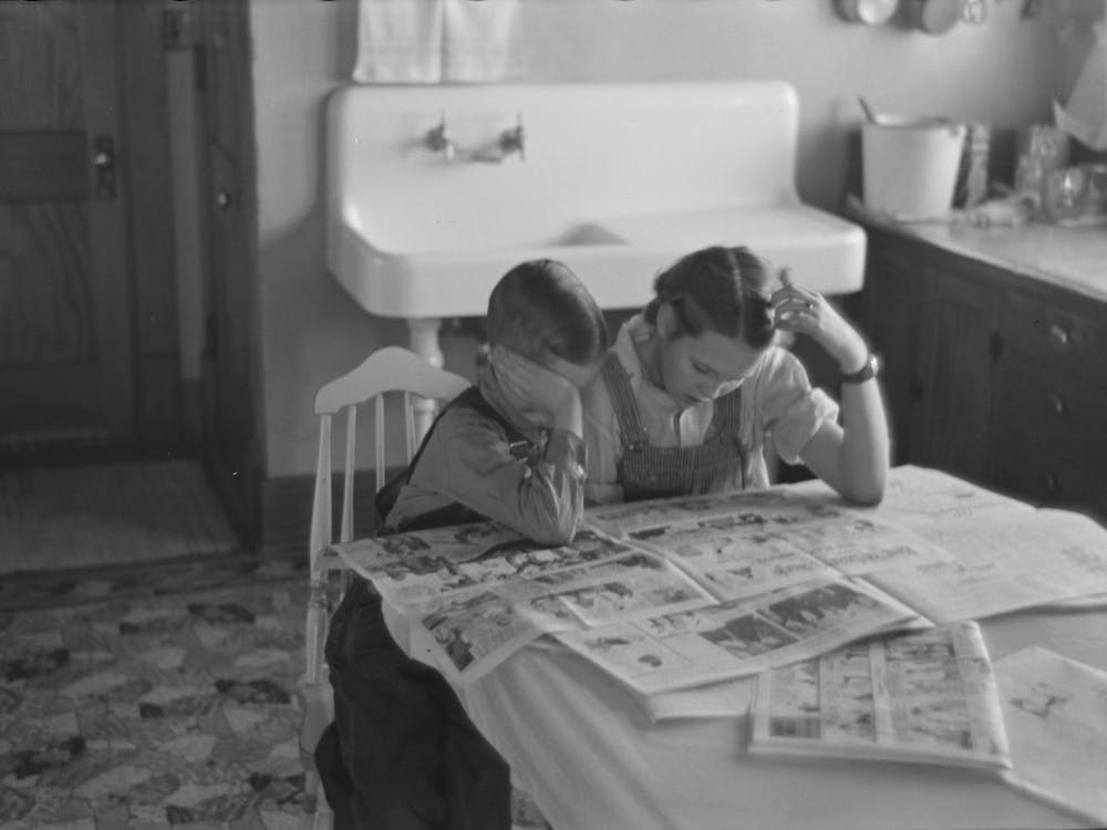 Children Reading Sunday Papers, Rustan Brothers Farm Near Dickens, Iowa, Note Convenience Of Running Water In