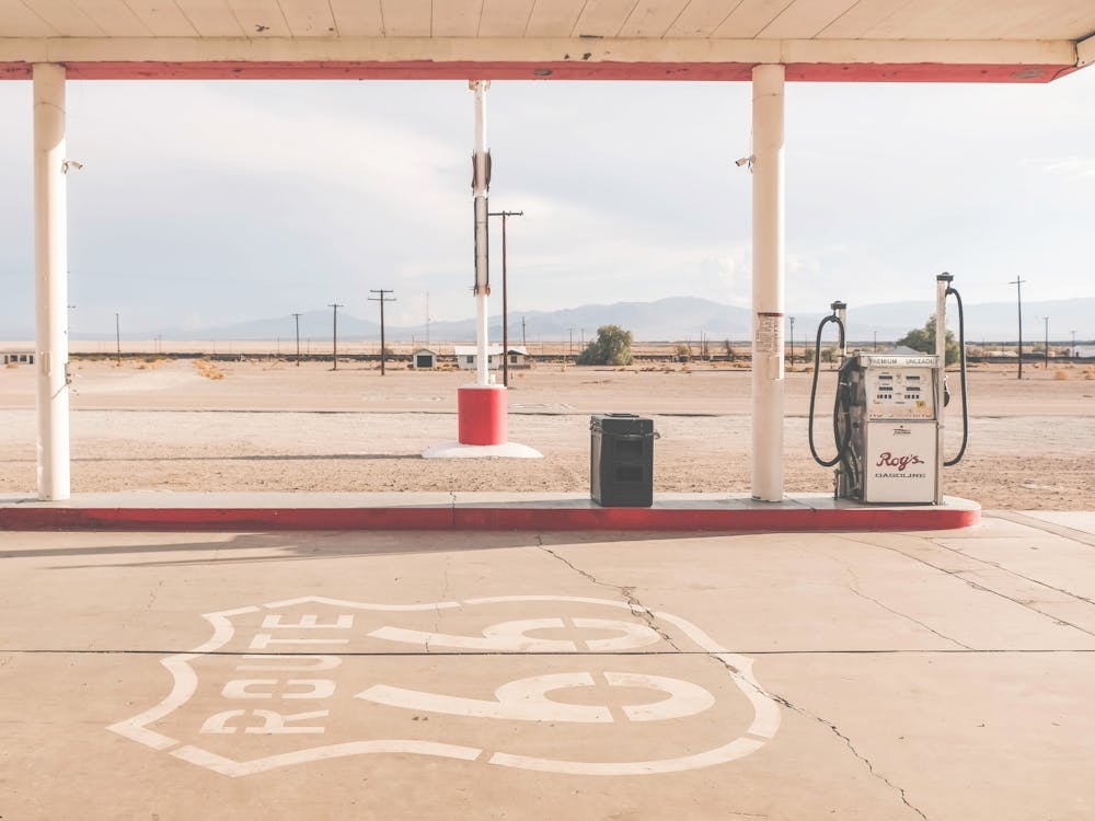 Route 66, USA I Retro vintage gas station in California Mojave Desert with sunny pastel aesthetic photography at the legendary Roy's Motel Cafe in the American countryside with its analog film ambience vibes