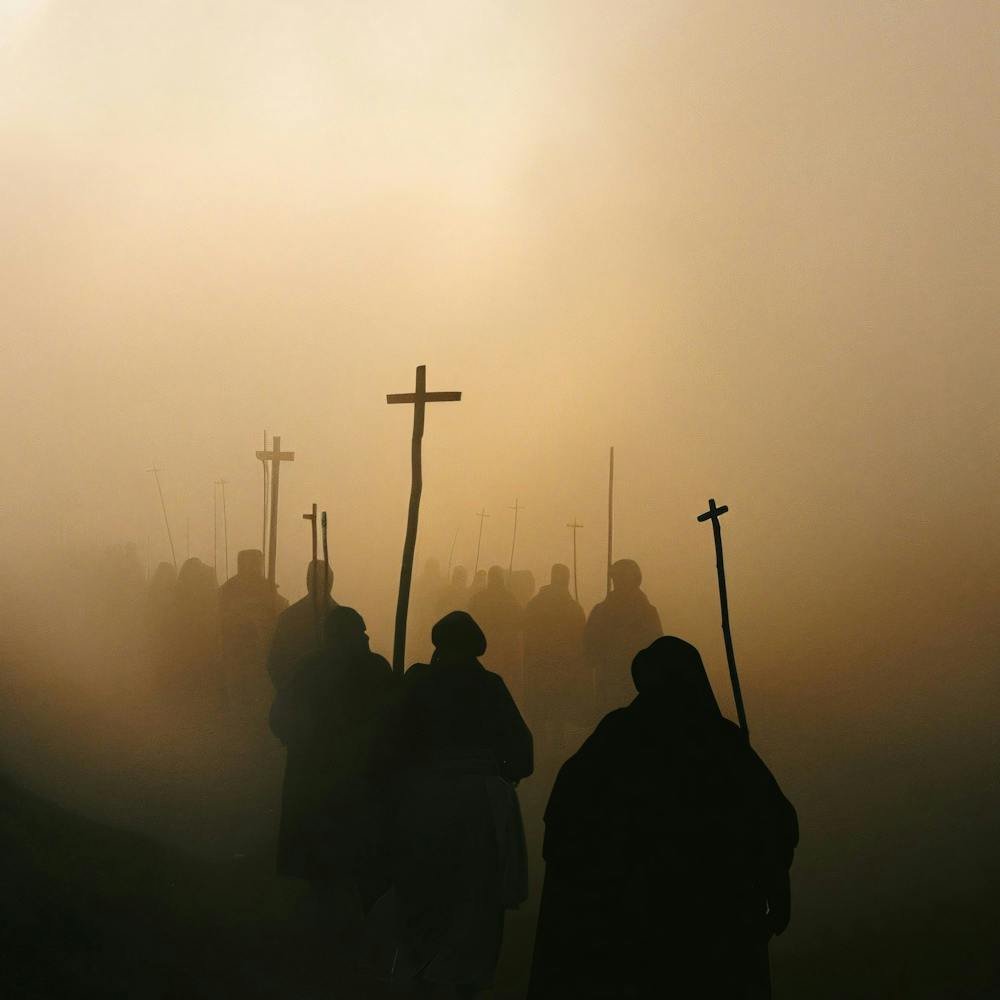 Silhouette Of Pilgrims Walking In The Fog