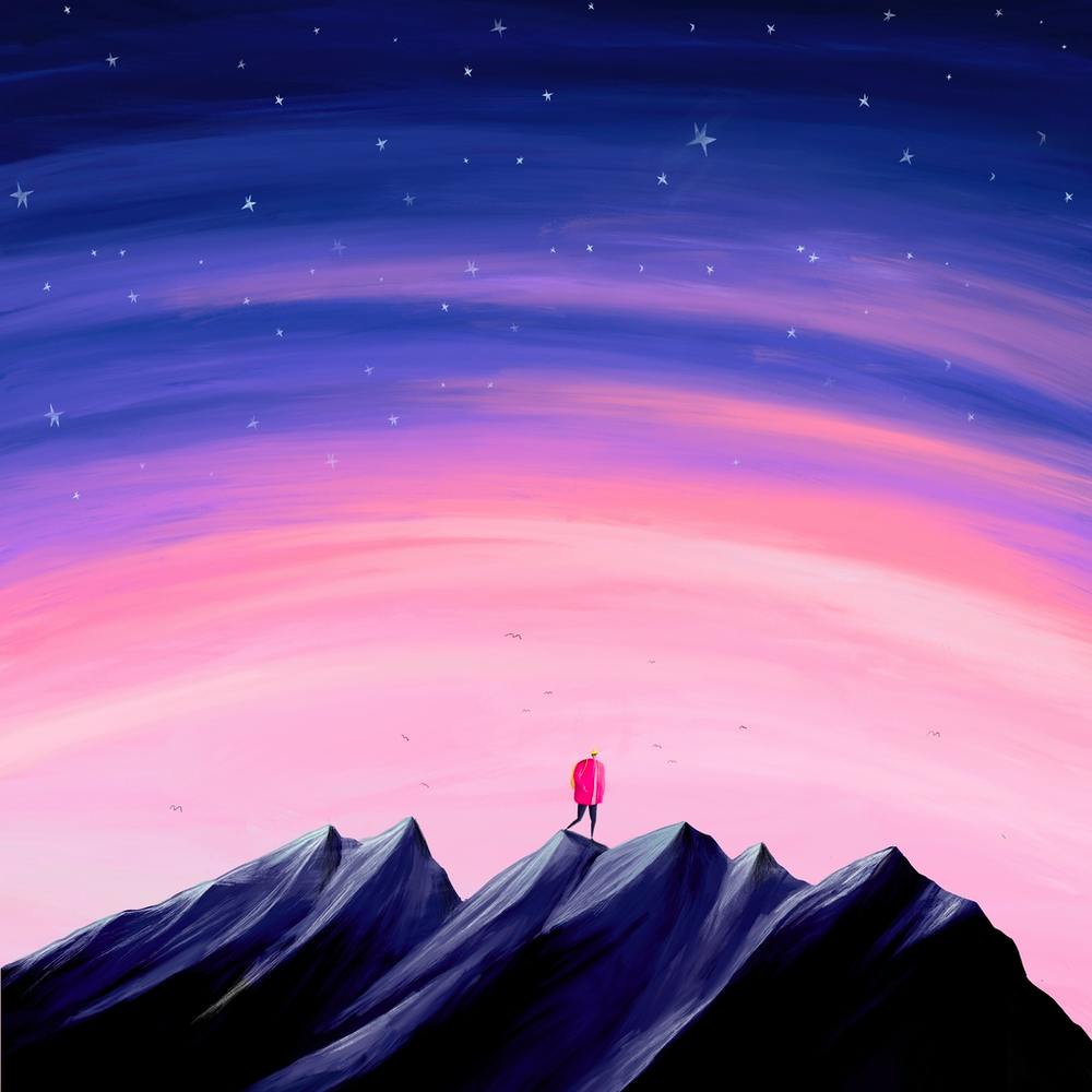 Person Standing On Top Of Mountain