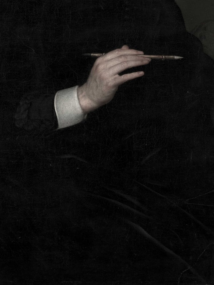 Portrait Of A Man Holding A Pen