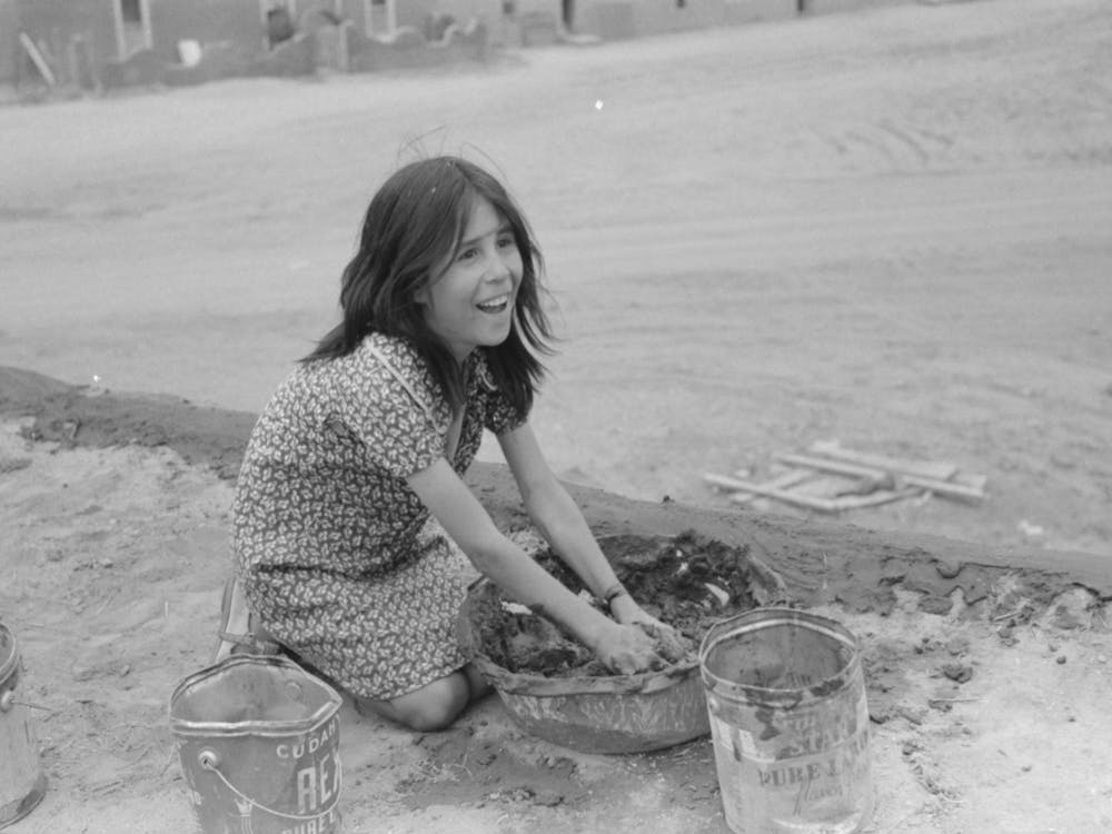 Untitled Photo, Possibly Related To Spanish American Girl Plastering Edge Of Roof Of Adobe House