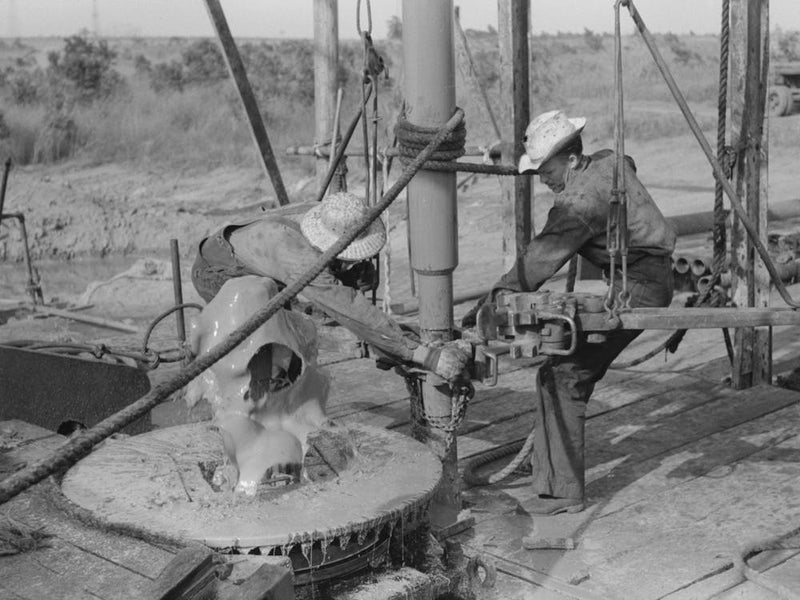 Adding A Length Of Drilling Pipe At Oil Well In Seminole Oil Field, Oklahoma, Wrench Applied To Loosen Pipe By Russell Lee