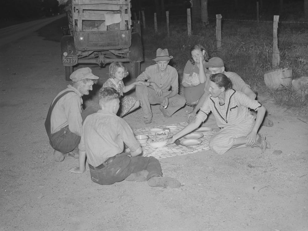 Migrant Family Encamped Along Roadside Eating Meal, Near Henryetta, Oklahoma By Russell Lee