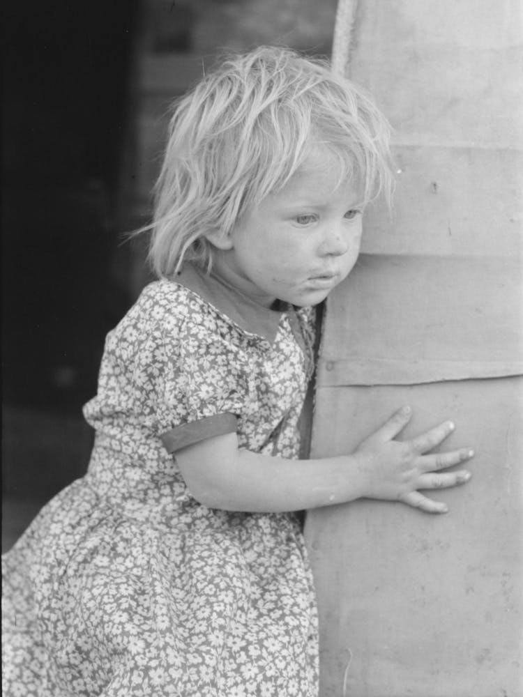 Migrant Child Standing In Doorway Of Trailer, Edinburg, Texas By Russell Lee