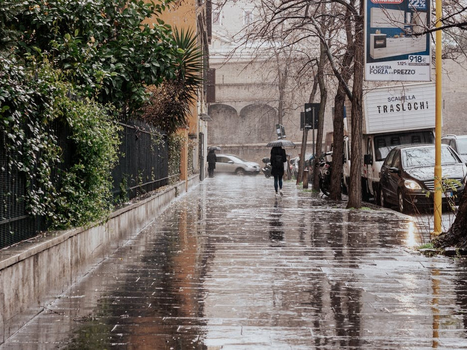 The Girl With The Umberella In The Rainy Streets Of Rome Italy