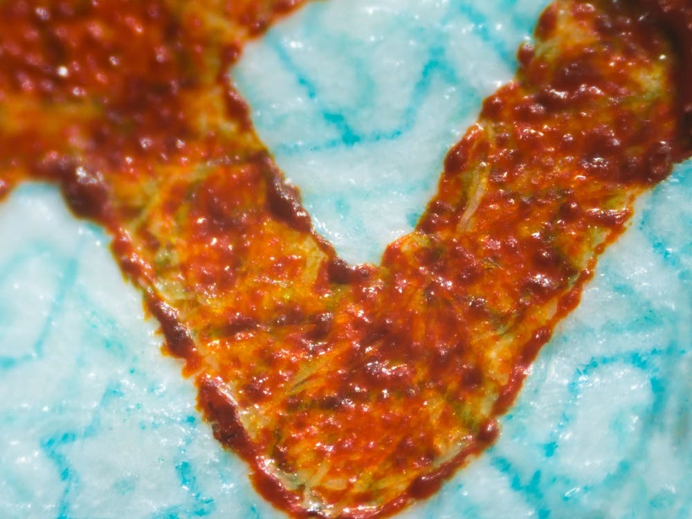 Abstract Blue Orange Pattern Fabric Texture On Israeli Money Bill Of 50 Shekel Under The Microscope