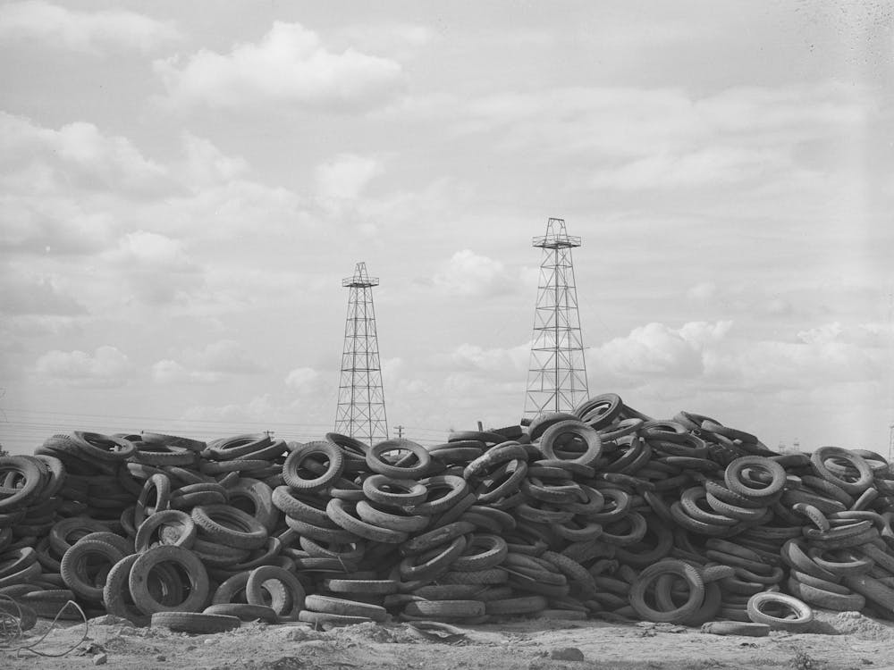 Piles Of Worn Out Automobile Tires In Oil Fields At Kilgore, Texas, Bad Roads And Heavy Trucking In The Oil Fields Cause