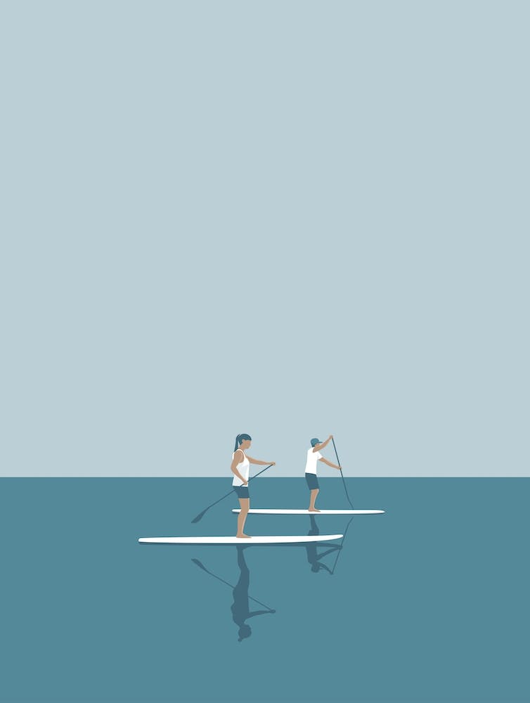 Paddle boarding couple