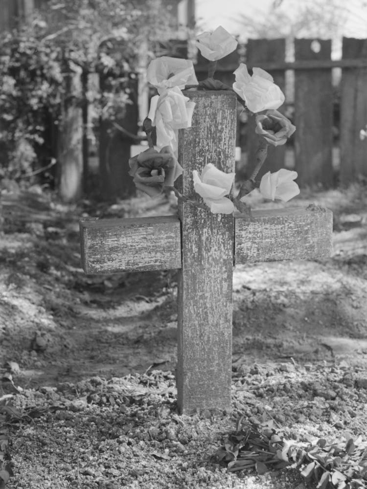 Decorated Headstone In Cemetery, New Roads, Louisiana On All Saints Day, Artificial Flowers Are Made Of Paper By