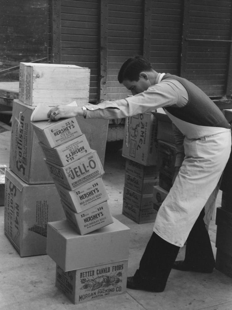 Checking Delivery Of Supplies From Wholesale Grocery Store, San Angelo, Texas By Russell Lee