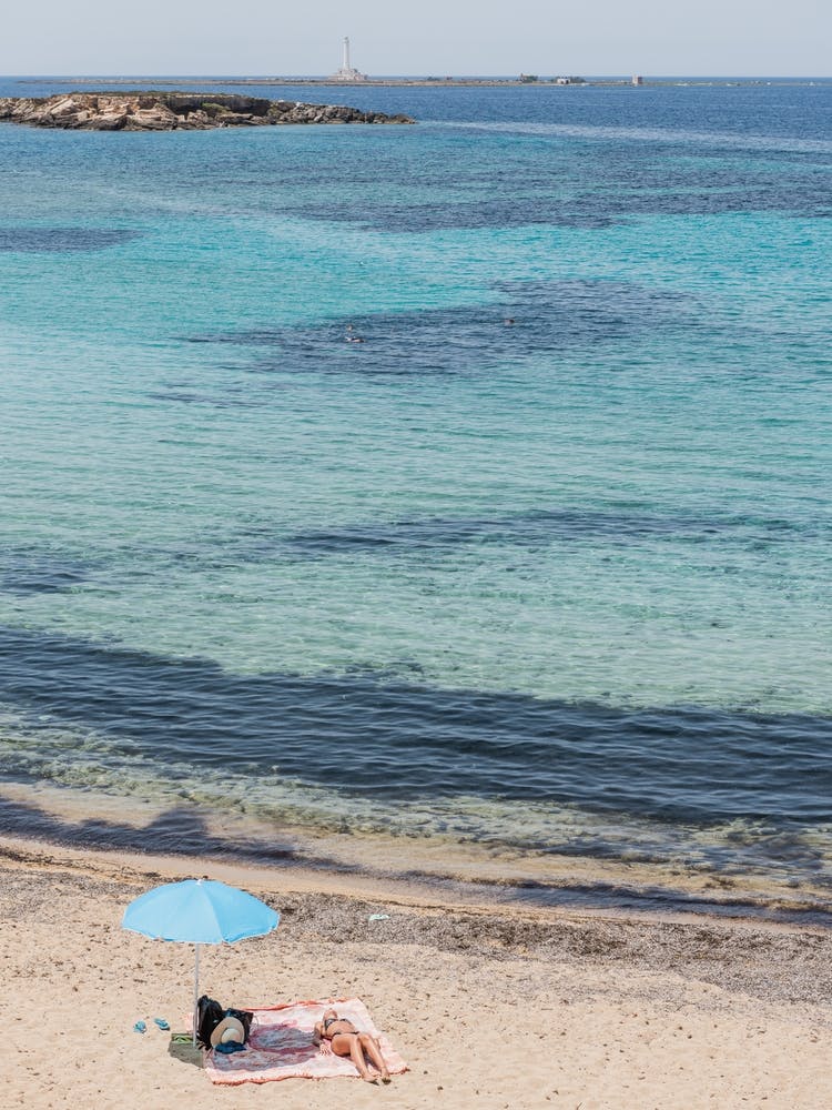 Sunbathing On The Beach